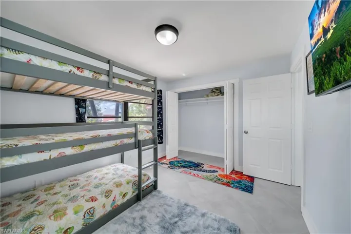 Bedroom with a closet and baseboards