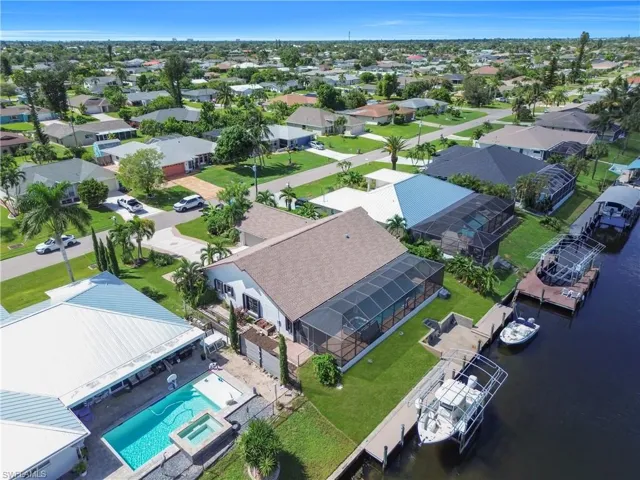Drone / aerial view of a large body of water and a pool