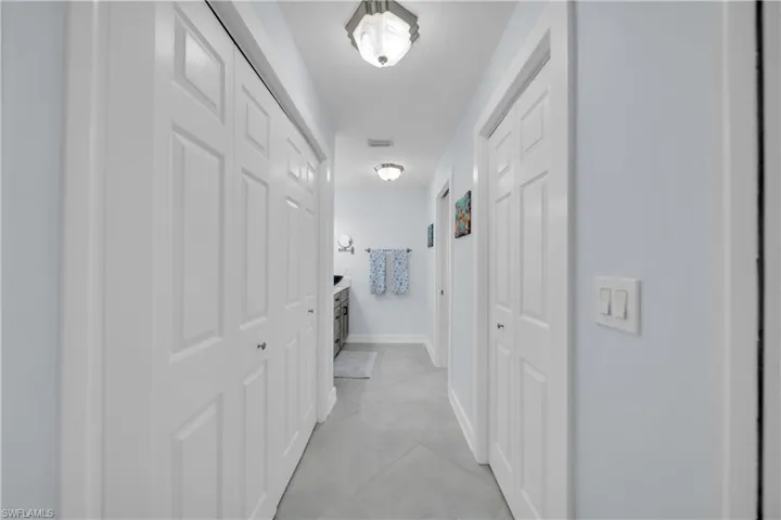 Corridor featuring baseboards