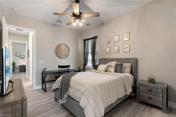 Bedroom featuring ceiling fan and light hardwood / wood-style floors