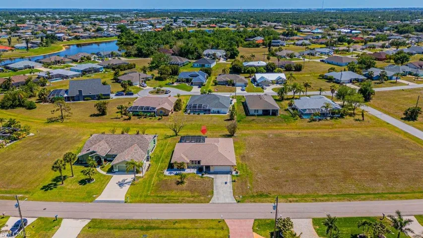 Aerial view of residential area with a nearby body of water