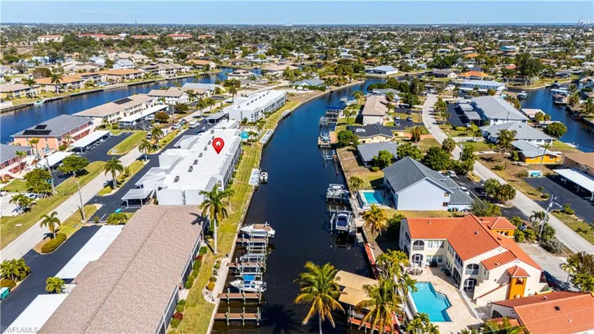 View of property location featuring nearby suburban area and a nearby body of water