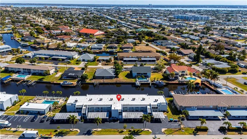 Aerial overview of property's location featuring a large body of water