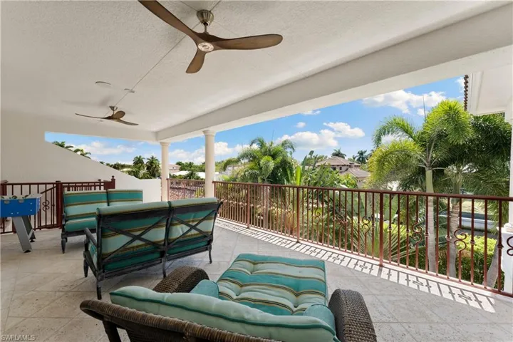 View of patio / terrace with an outdoor living space and ceiling fan