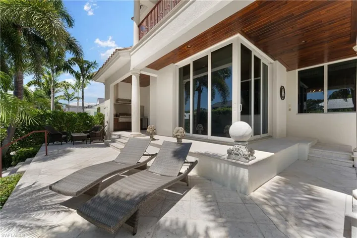 View of patio featuring a balcony
