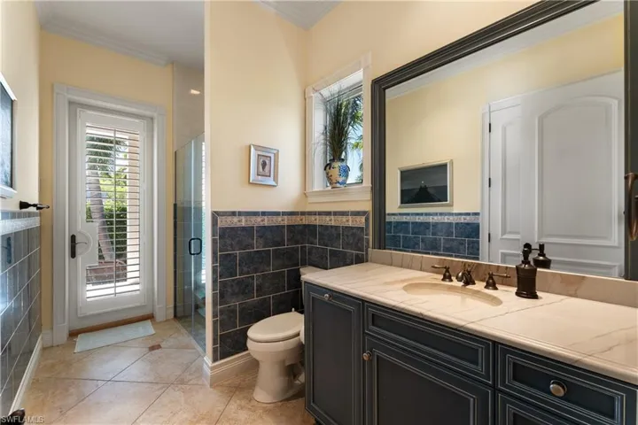 Designated Pool Bath / access to summer kitchen.