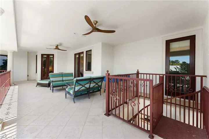 View of patio / terrace with ceiling fan and an outdoor living space