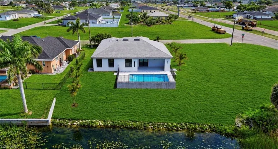 Contemporary single-story residence featuring a white exterior and a gray shingle roof