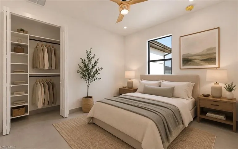 Bright interior room featuring a built-in closet system with shelving and hanging rods