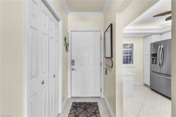 Looking toward the front door from within the foyer. 24" diagonal tile