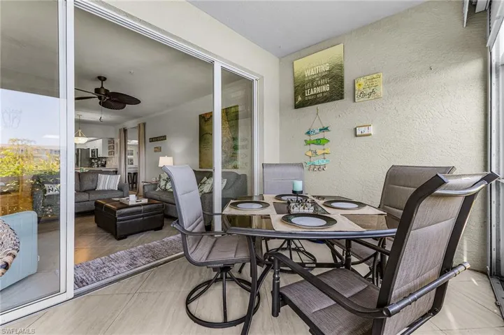 This view is overlooking the lanai dining into the living area. The double set of sliders allows for doors to be stacked to either side or each side (as seen here).