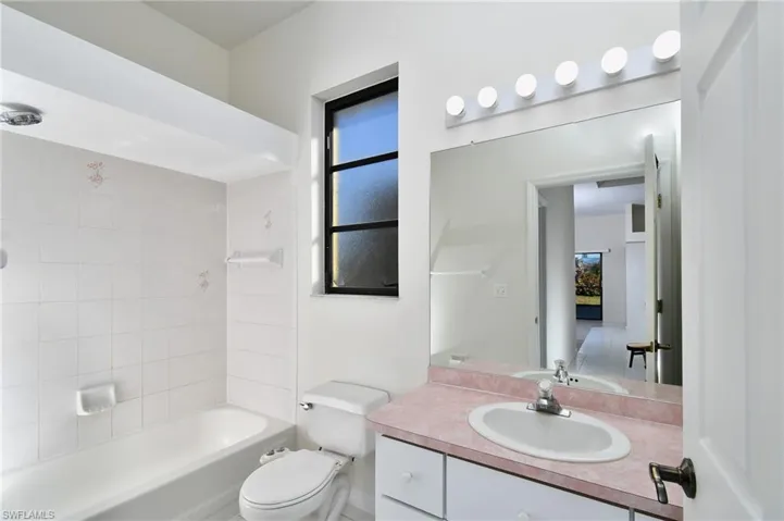 Bathroom with vanity and shower / bathtub combination