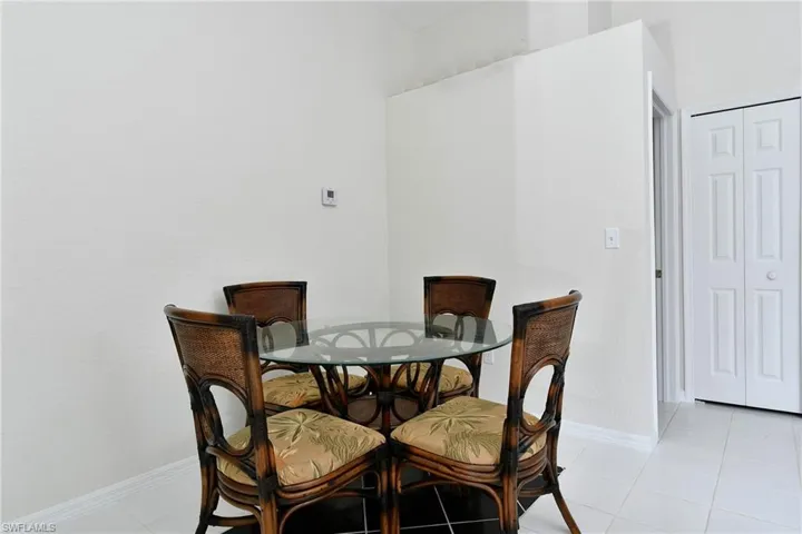 Dining area with baseboards and light tile patterned flooring