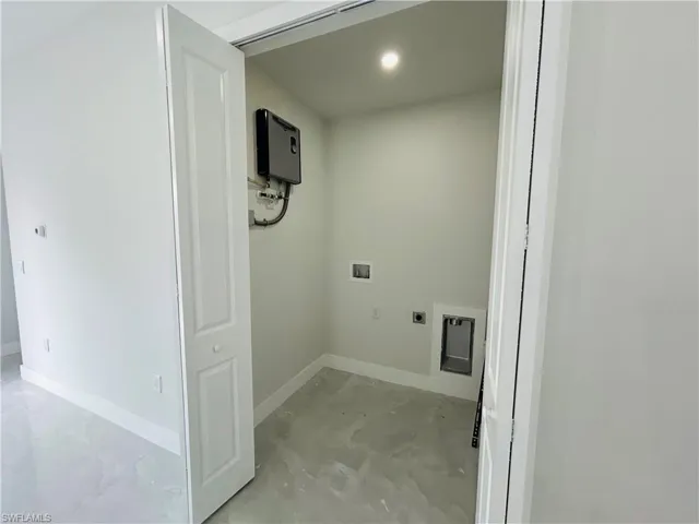 Washroom featuring washer hookup, electric dryer hookup, baseboards, and recessed lighting