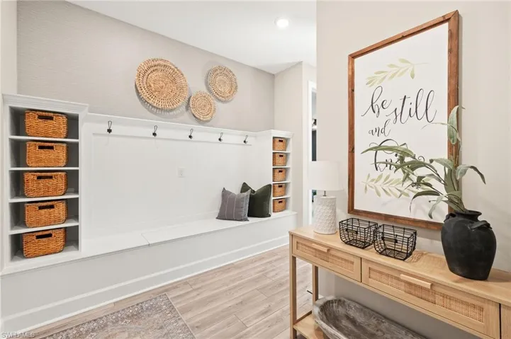 Mudroom featuring light wood-type flooring and recessed lighting