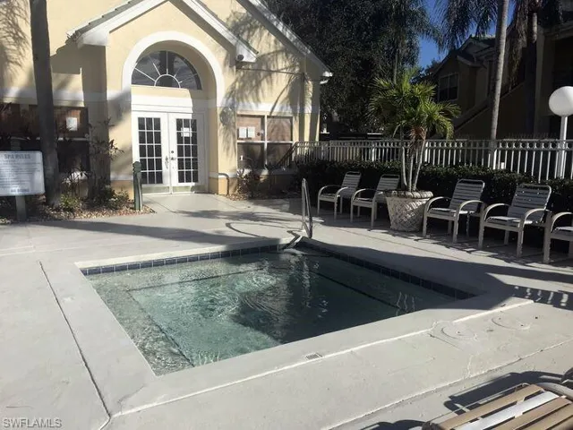 View of swimming pool featuring french doors, patio surround, and a swimming pool