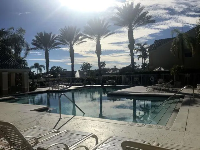 Community pool with a patio area