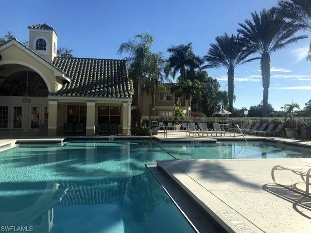 Community pool featuring a patio area