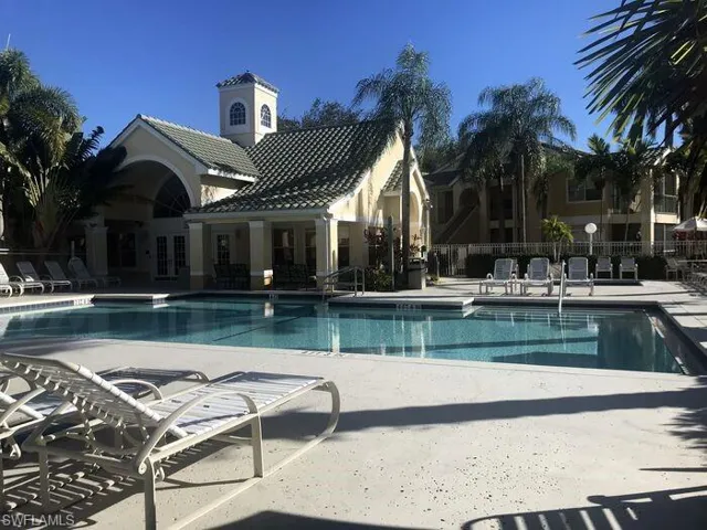 Community pool featuring a patio area