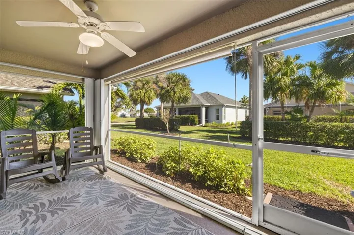 Unfurnished sunroom with ceiling fan
