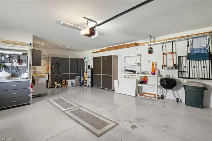 Garage featuring a garage door opener