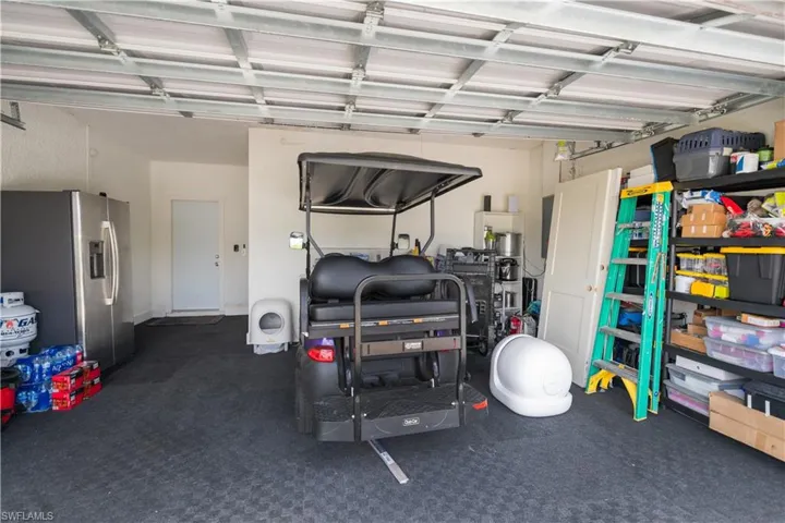 Garage with stainless steel fridge