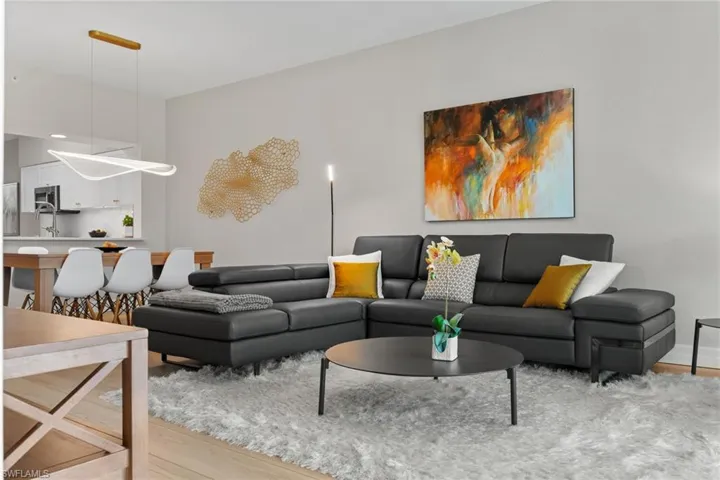 Living room with light wood-type flooring