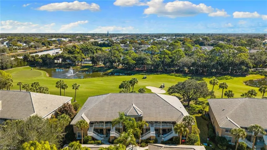 Drone / aerial view of a golf course and a large body of water