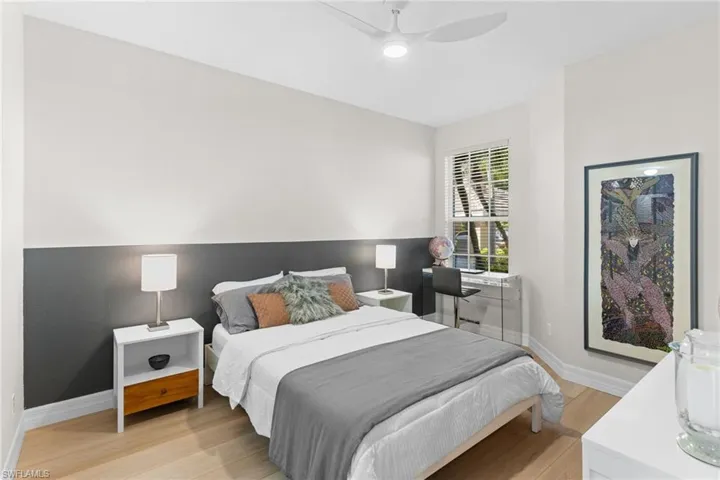 Bedroom with ceiling fan and light wood finished floors
