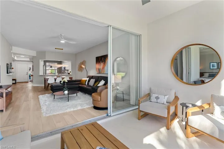 Living room featuring ceiling fan and baseboards