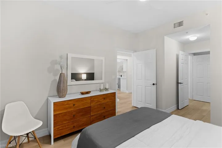 Bedroom with light wood-style flooring and a ceiling fan