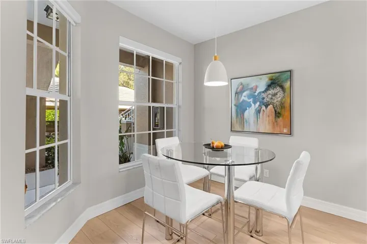 Dining room featuring wood finished floors and baseboards