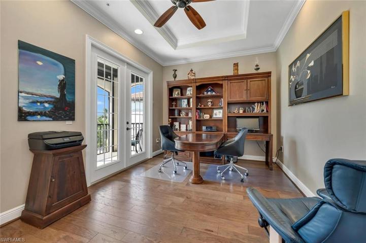 Spacious den features hardwood floors and private balcony.