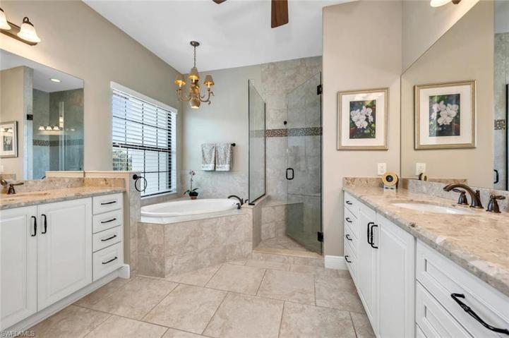 Master Bath with soaking tum, walk-in shower, dual sinks and ceiling fan.
