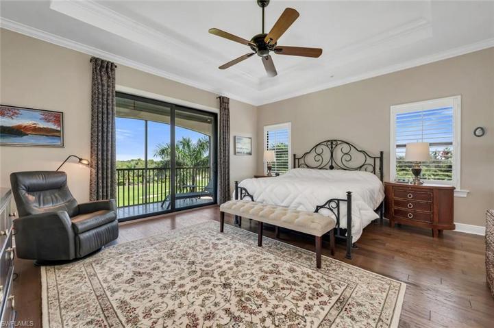 Master bedroom complete with engineered hardwood floors and private balcony.