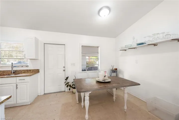 Dining area featuring vaulted ceiling