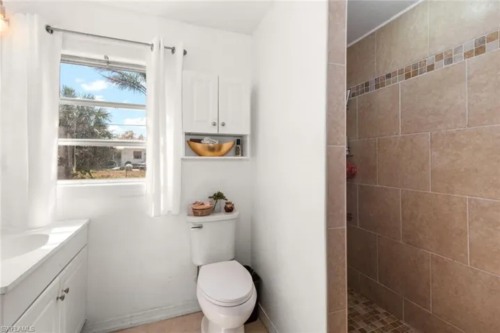 Bathroom with vanity and a walk in shower