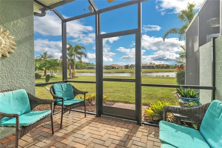 Sunroom / solarium with a water view