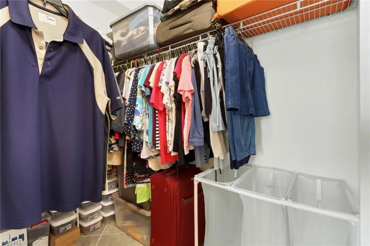 Walk in closet with tile patterned floors