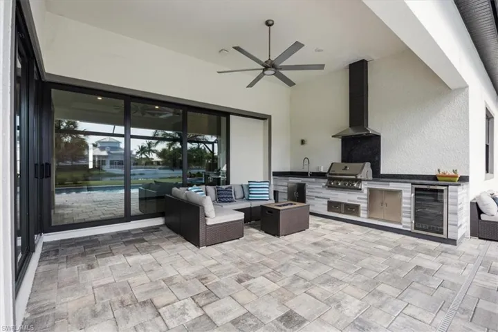 out door natural gas kitchen with sink, cooler & storage-   marble stone and leathered granite countertops