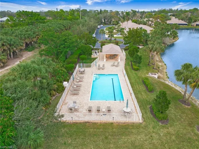 View of pool featuring a patio area, a gazebo, and a water view