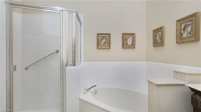 Bathroom with vanity and independent shower and bath