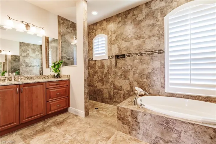 Private en-suite bathroom adjacent to primary bedroom