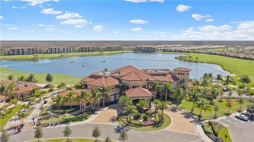 Drone / aerial view with view of golf course and a water view