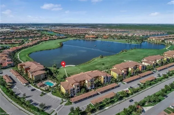Bird's eye view with view of golf course and a water view