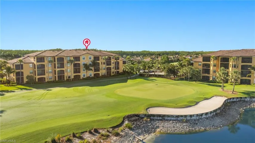 View of home's community with golf course view and a water view