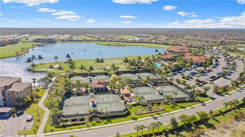 Birds eye view of property with a water view