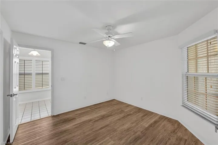 Access the second bedroom from the kitchen or the main living area.