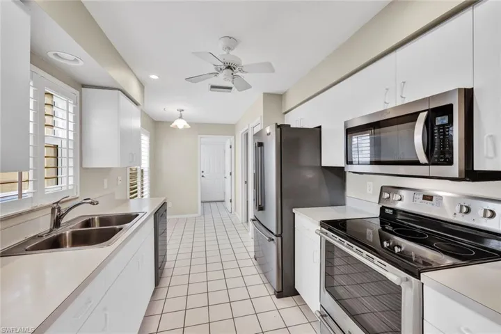 Kitchen features stainless Maytag appliances.