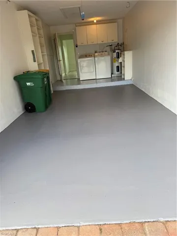 Garage with water heater and washer and dryer
